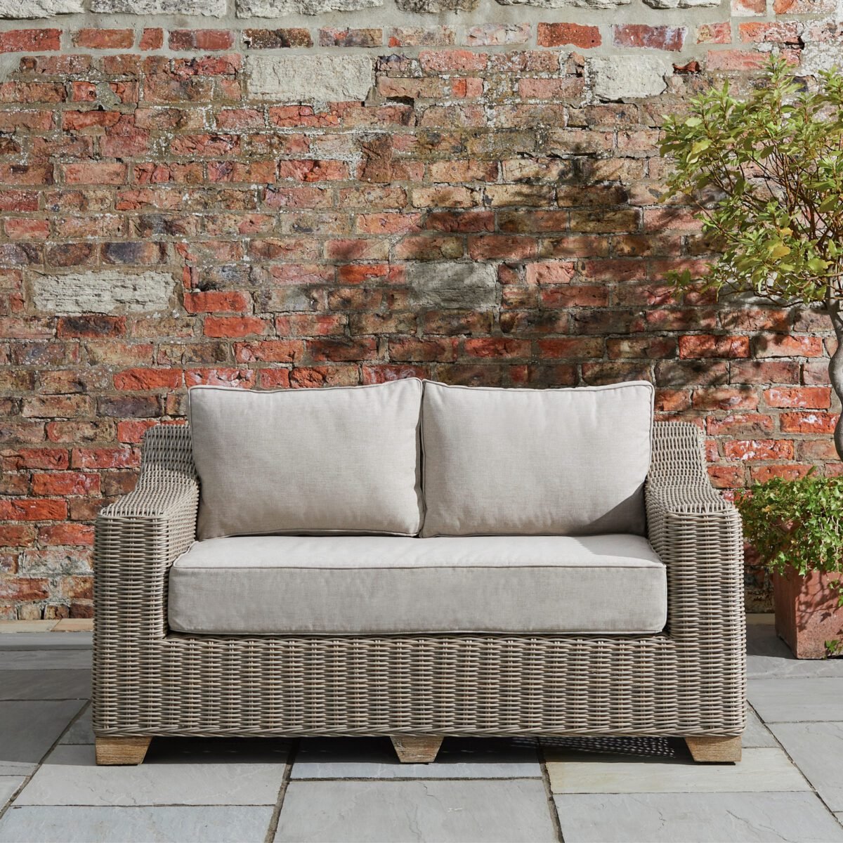 Capri Collection Outdoor Two Seater Sofa Weather-defiant HDPE wicker sofa with quick-dry Olefin cushions. Rust-proof aluminum frame with eco-friendly wood feet. Low-maintenance design perfect for year-round use. No-rust aluminum construction Fast-drying, fade-resistant fabric Weather-resistant wicker weave Code: 22953 Dimensions: 92L x 150W x 70H